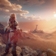 Aloy in Horizon Forbidden West, standing on top of a hill and looking on the horizon.